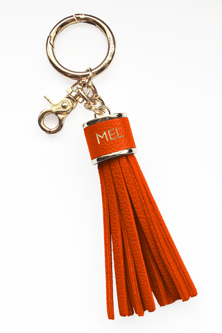 The Mel Boteri Pebbled-Leather Tassel Charm | Orange Leather With Gold Hardware | Mel Boteri Gift Ideas
