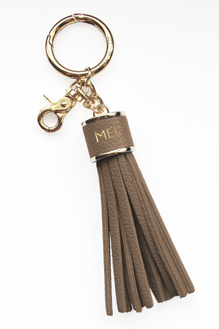 The Mel Boteri Pebbled-Leather Tassel Charm | Taupe Leather With Gold Hardware | Mel Boteri Gift Ideas